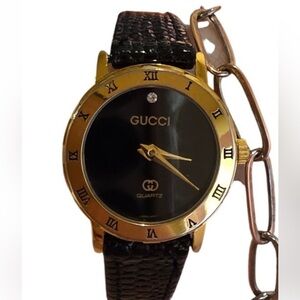 Gucci Black Dial Gold Tone Roman Numeral Ladies Watch